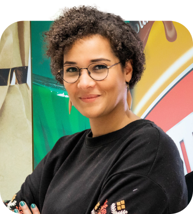 A woman smiling with her arms crossed