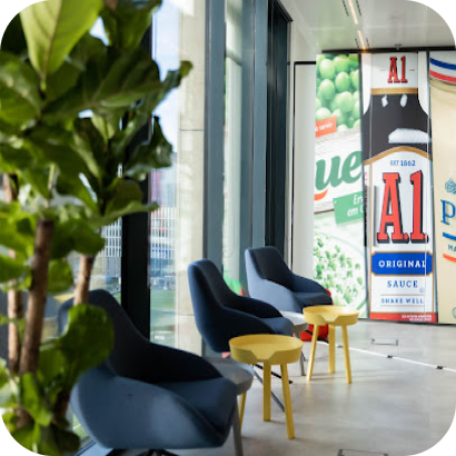 An office with Kraft Heinz product images on the wall